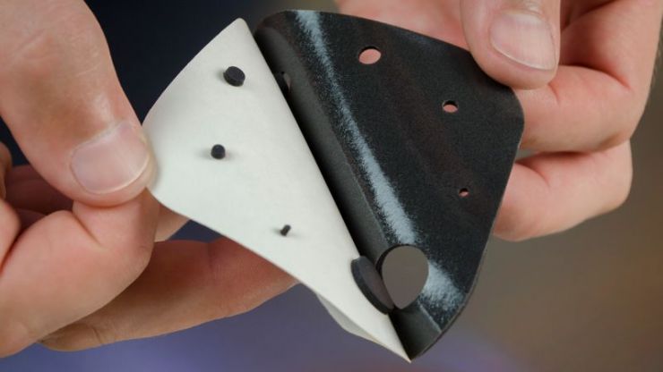 Laser-cut pressure-sensitive adhesive material